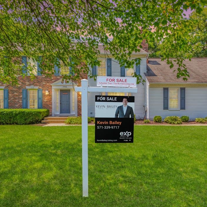 A Kevin Bailey listing with a sold sign in the front yard