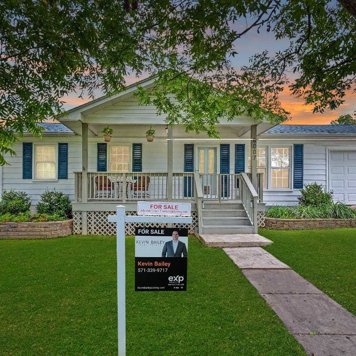 A Kevin Bailey listing marketed with a for-sale sign out front